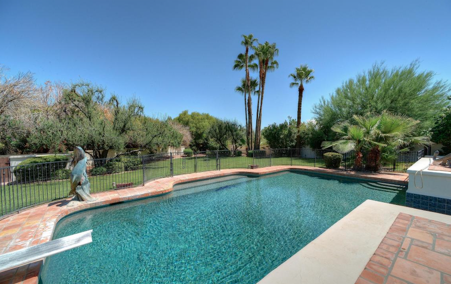 Paradise Valley stunning covered patio overlooking sparkling pool and mountain views at Finisterre $1,400,000.png