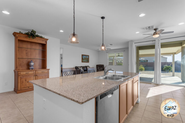 Open kitchen and living area in a Maricopa AZ single-level home with large garage