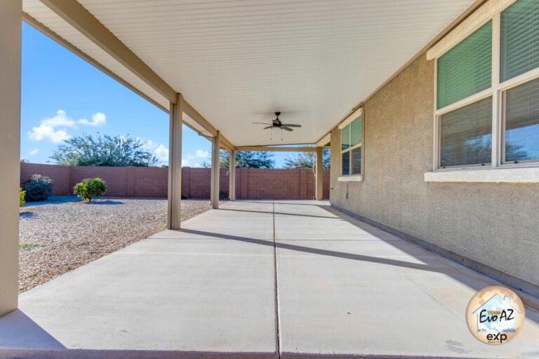 Covered patio of a Maricopa AZ single-level home with large garage, ideal for outdoor entertaining