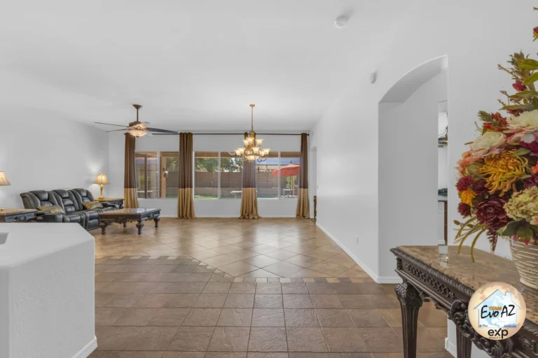 Formal living and dining space with tile floors and neutral finishes