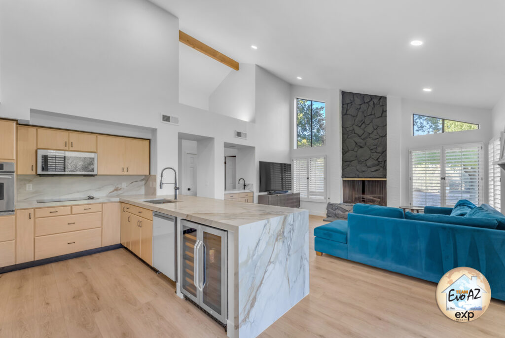 Remodeled kitchen with waterfall countertops and modern cabinetry