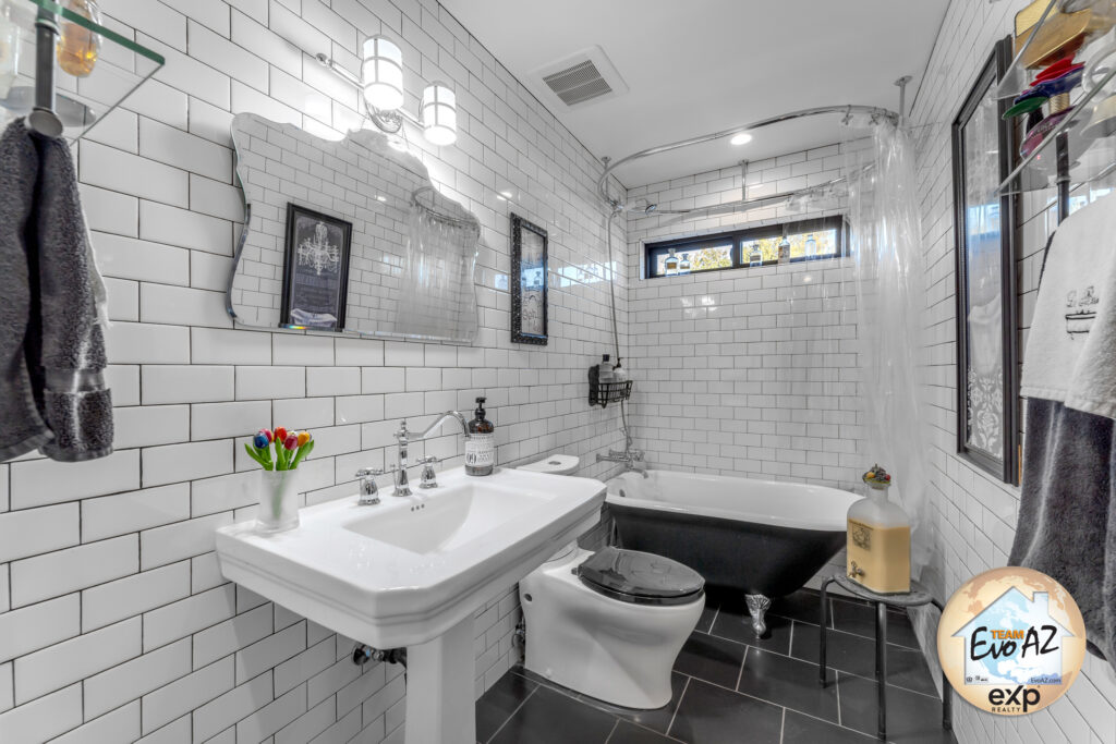 Guest bathroom featuring a claw foot tub and pedestal sink