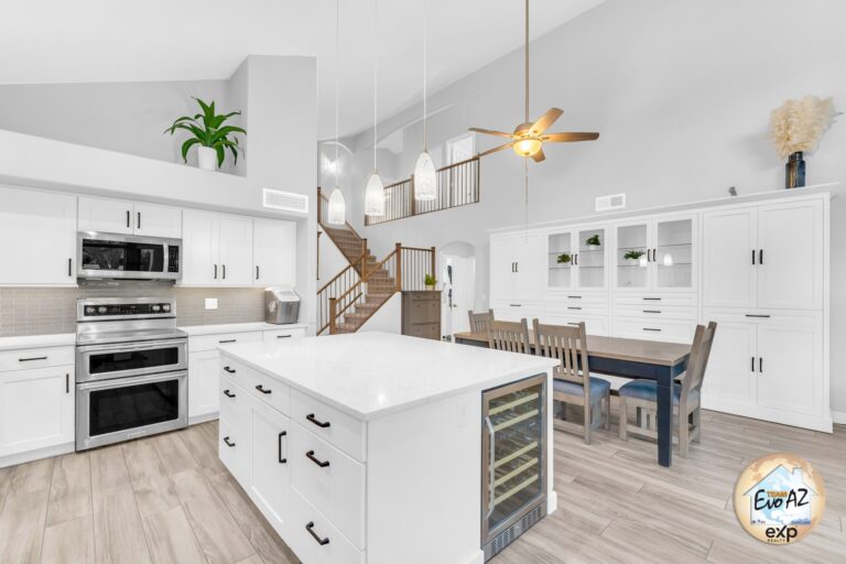 Bright modern kitchen with large island and white cabinetry in a move in ready