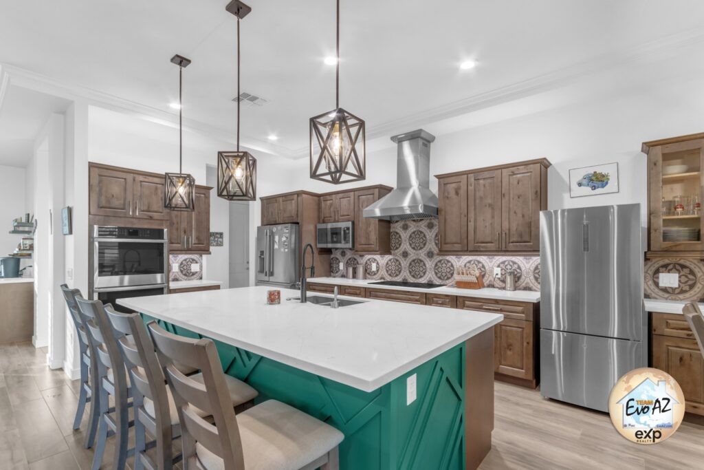 Upscale kitchen with large island and designer finishes in a custom-built home in Surprise Arizona