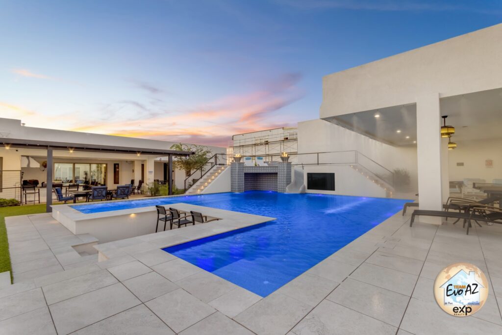 Modern pool with water features and tile finishes