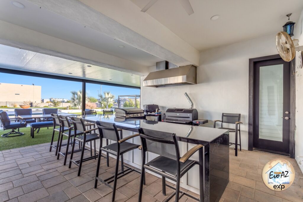 Covered patio with outdoor dining and entertainment area