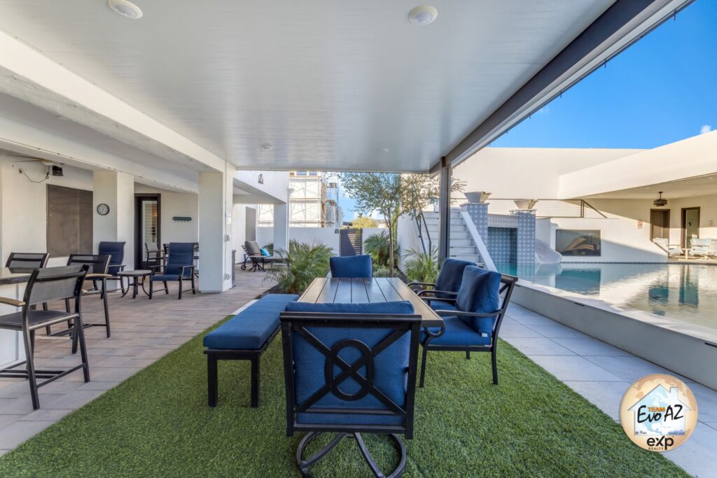 Backyard lounge and patio space designed for entertaining at a custom home in Surprise Arizona