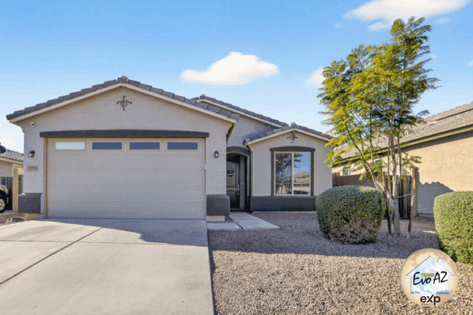 Front exterior of a single level San Tan Valley home for sale with two car garage and desert landscaping