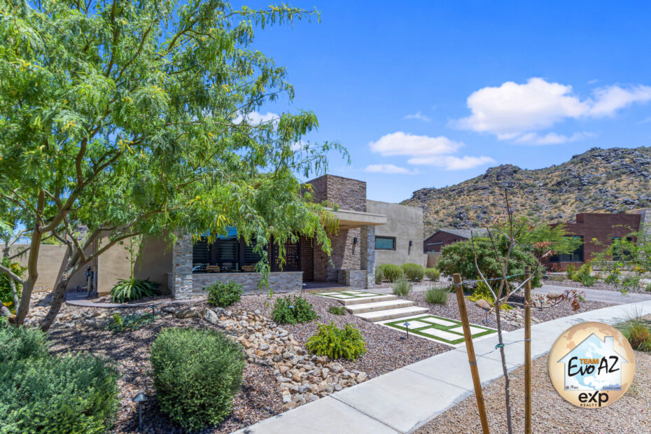 Phoenix luxury home with mountain views front exterior in Vistal Phase 1 near South Mountain. Discover this Phoenix luxury home with mountain views featuring 6 bedrooms, resort-style backyard, heated pool and spa, 4-car garage, and stunning South Mountain views.