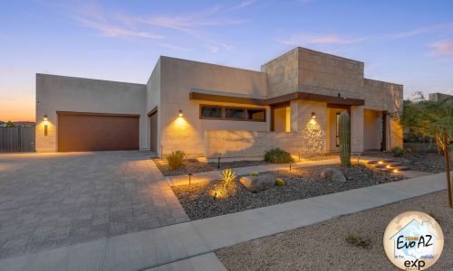 luxury home with mountain views in Phoenix front exterior on corner lot with desert landscaping